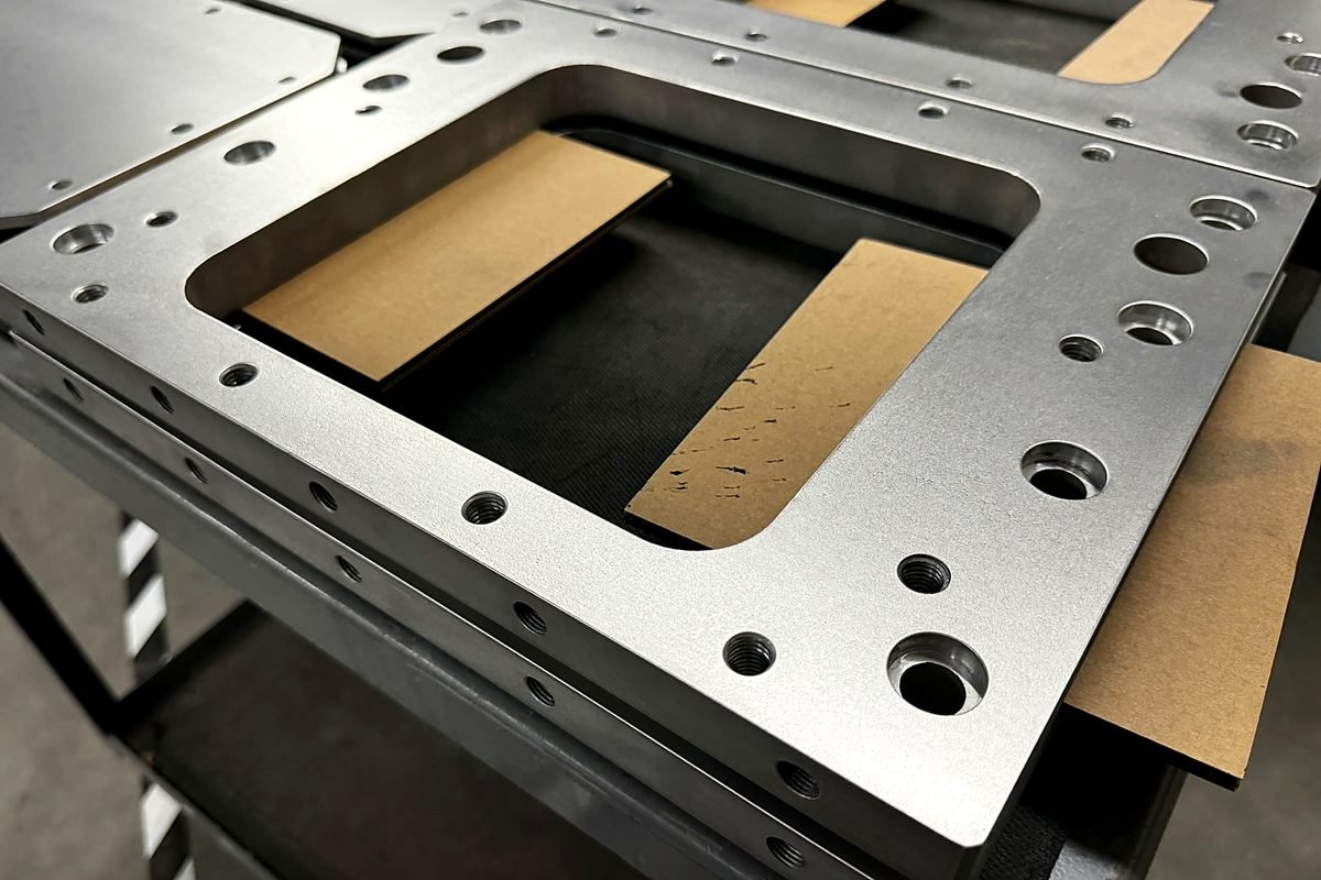 Waterjet cut steel plate with counterbored holes at ACP Waterjet
