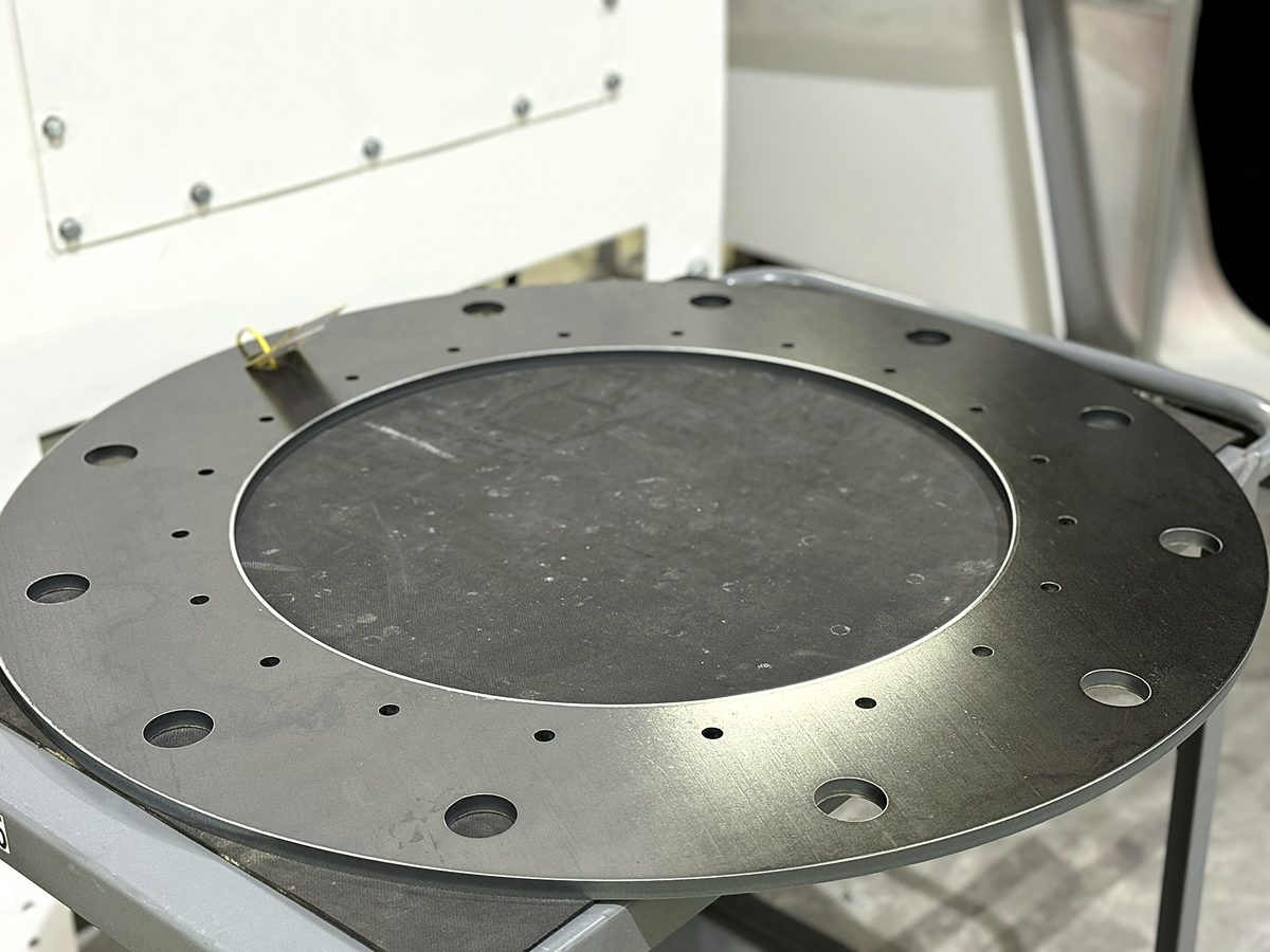 A laser cut steel ring flange with bolt holes at ACP Waterjet