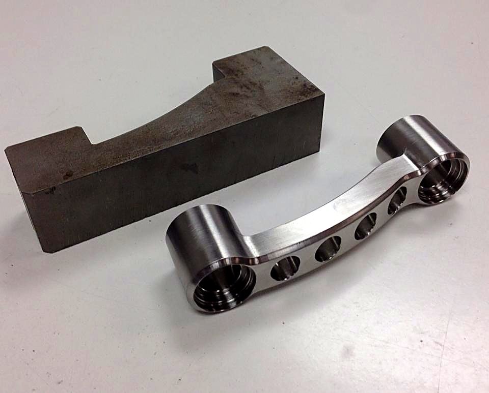 Steel blank and finished machined part cut for a machine shop by ACP Waterjet