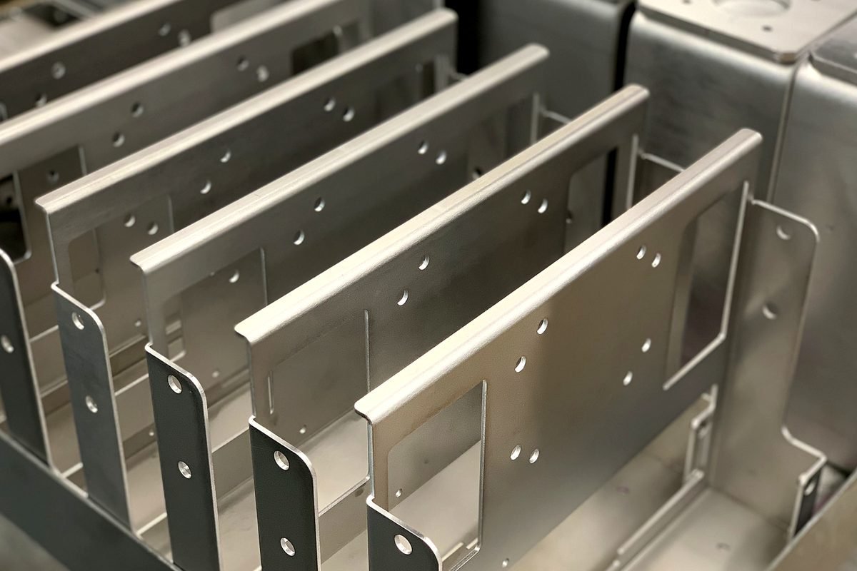 Formed aluminum sheet metal panels racked after bending at ACP Waterjet
