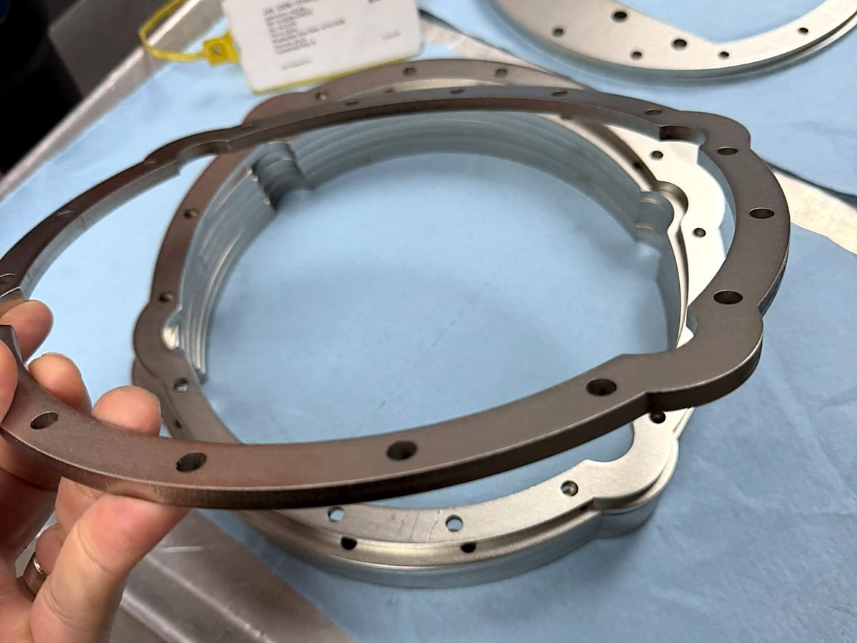 Waterjet cut stainless steel flange rings tagged for inspection at ACP Waterjet