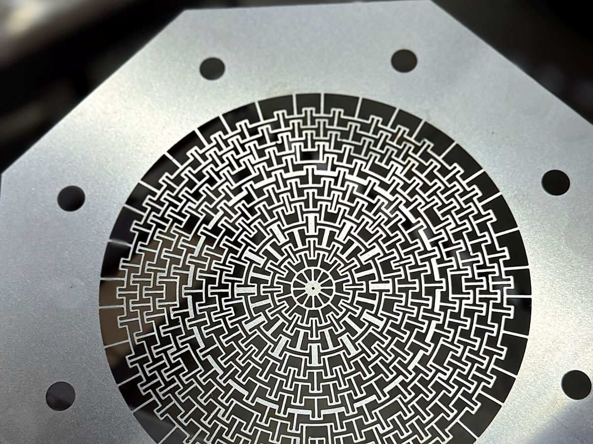 Laser cut stainless steel shim with an intricate flat profile at ACP Waterjet