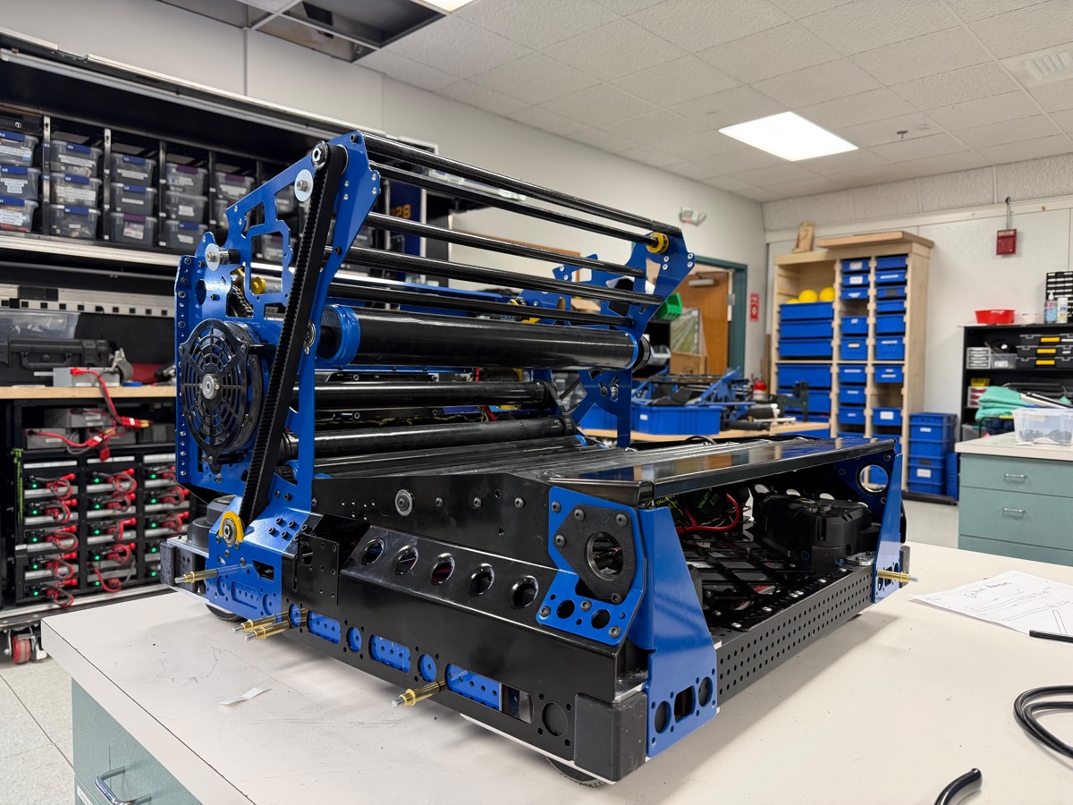 Littleton Robotics' 2026 robot Darwin on the bench, blue and black, built from bent sheet metal