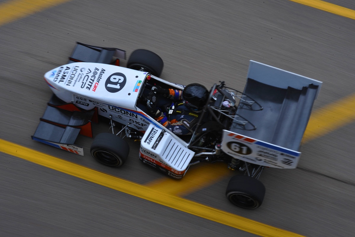 UConn Formula SAE car 61 and its driver racing on the autocross course, seen from above