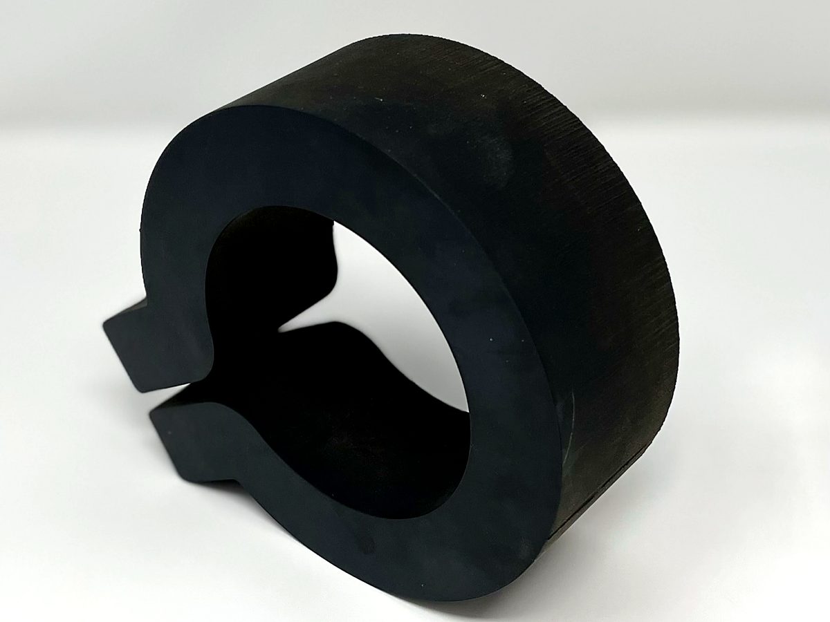 A 2 inch thick black rubber ring cut on the waterjet at ACP Waterjet