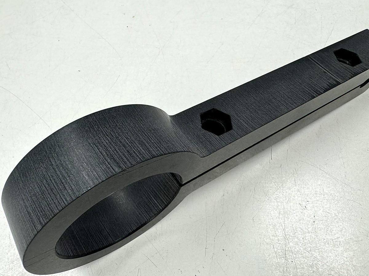 Waterjet cut Delrin wrench tool with clean edges and no heat marks